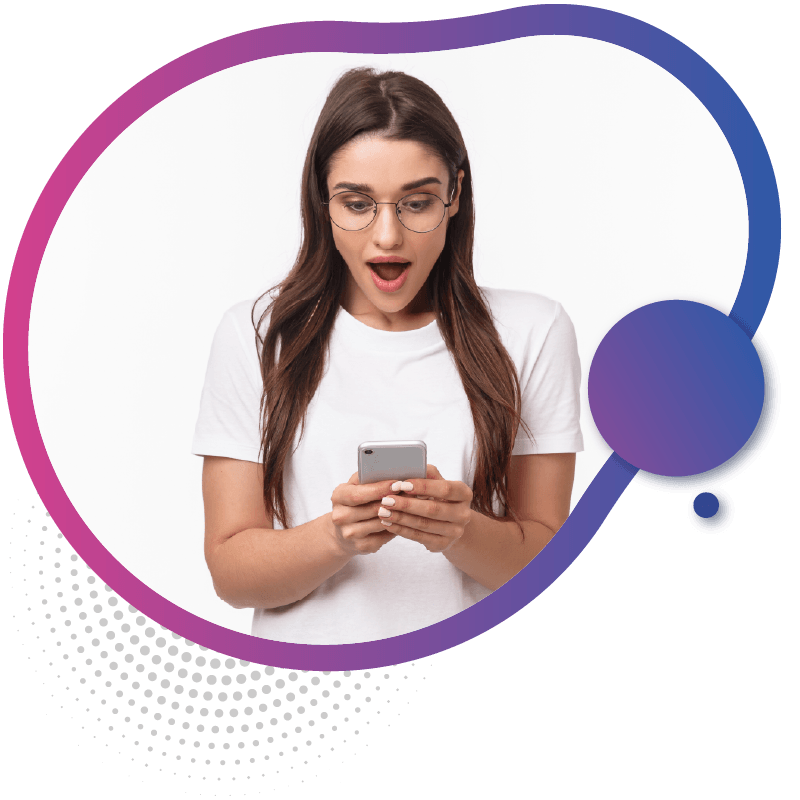 A woman holding a smartphone and looking down at the screen, possibly exploring options for eSIM Australia to stay connected during their trip