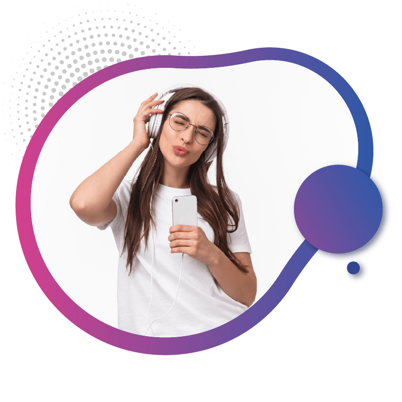 A woman wearing headphones holds a smartphone, with long hair cascading over their shoulders, likely using a eSIM for seamless connectivity